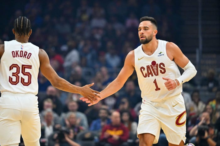 CLEVELAND, OHIO - OCTOBER 12: Isaac Okoro #35 celebrates with Max Strus #1 of the Cleveland Cavaliers during the first quarter of a preseason game against the Orlando Magic at Rocket Mortgage Fieldhouse on October 12, 2023 in Cleveland, Ohio. The Magic defeated the Cavaliers 108-105.